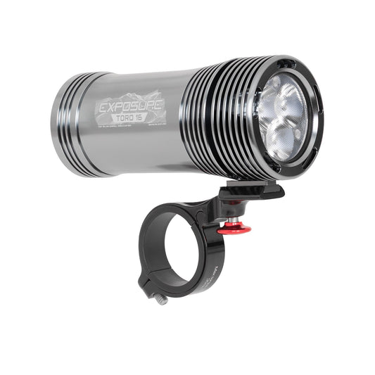 Exposure Lights Toro 16 rechargeable front bicycle light with gunmetal grey CNC-machined aluminium body, 3850-lumen output, colour OLED display and REFLEX 2.0 technology.