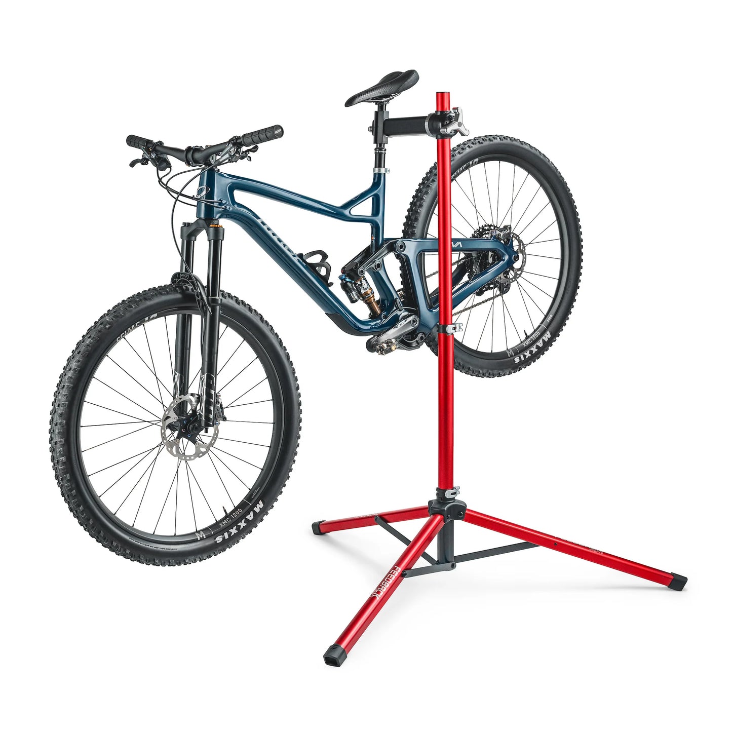 Feedback Sports Pro Ultralight bike repair stand standing with a bicycle mounted