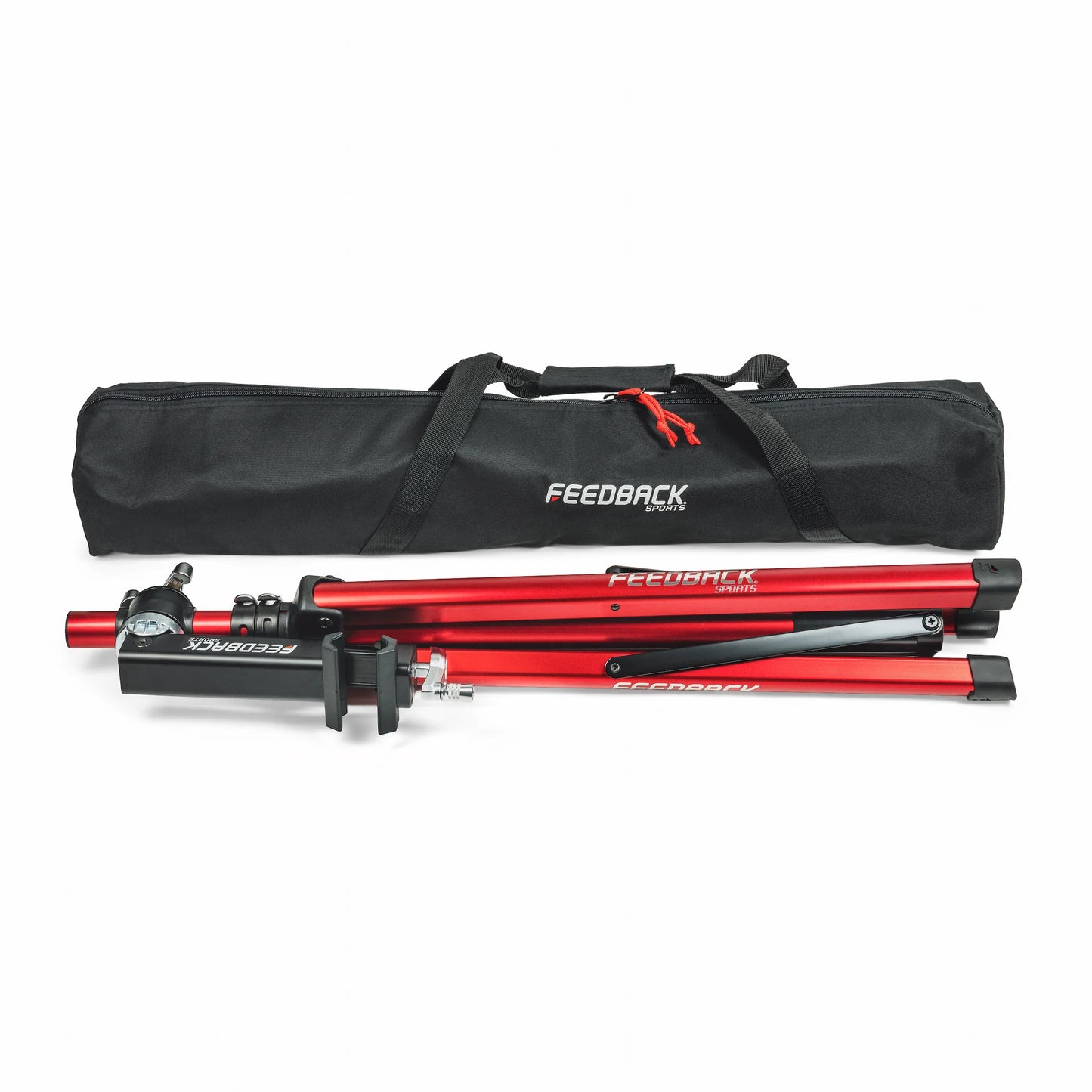 Feedback Sports Pro Ultralight bike repair stand folded and lying down next to the porter bag