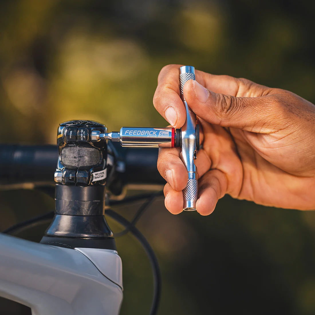 Feedback Sports mini ratchet torque tool with a 5mm allen bit in use 