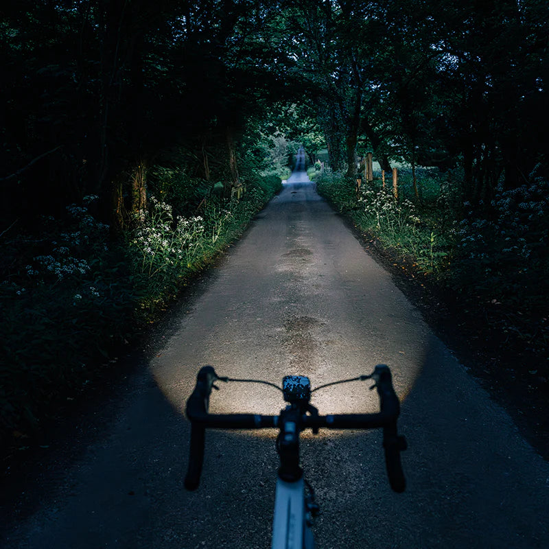 Magicshine EVO 1100 bike light iluminating a path