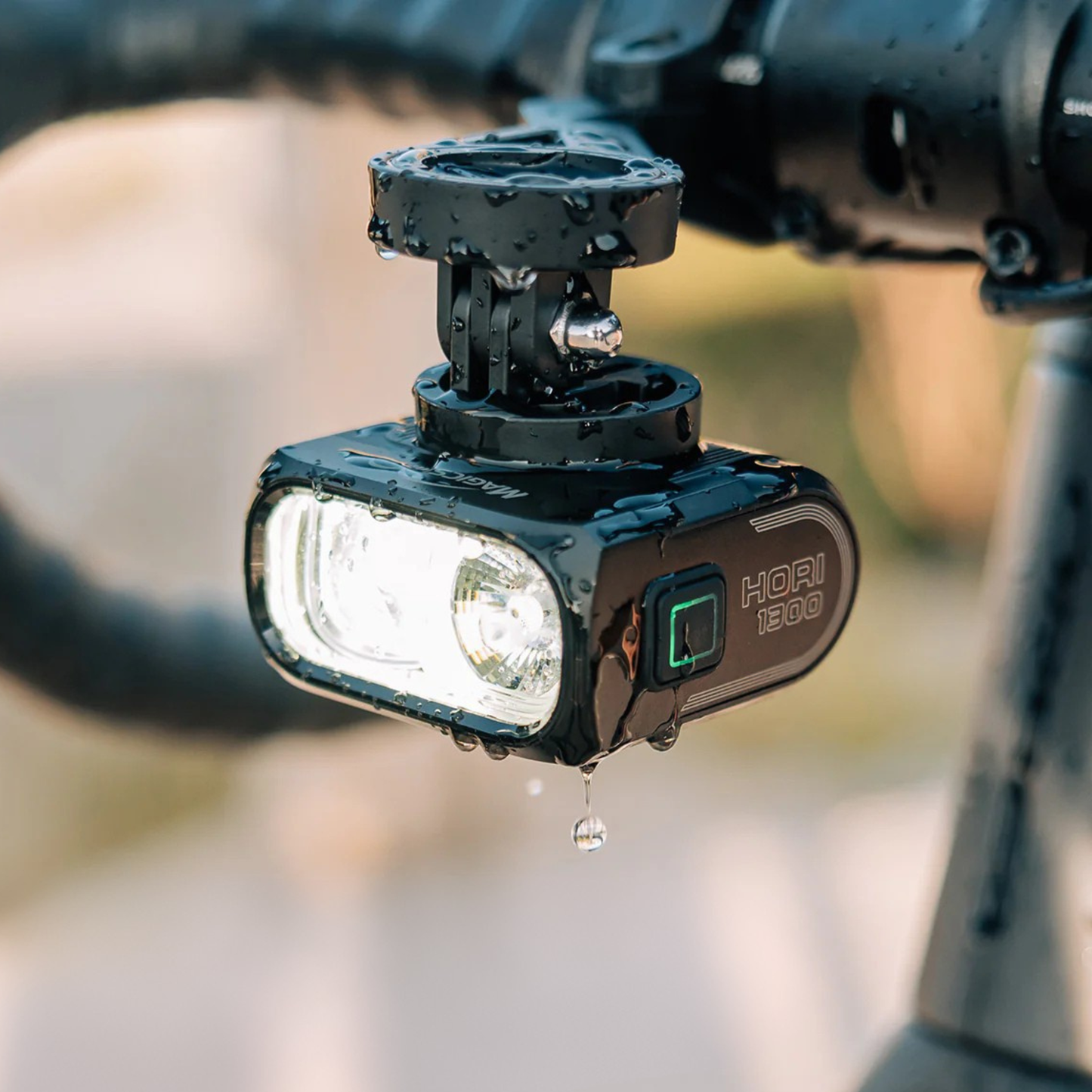 Magicshine Hori 1300 wet under rain mounted on a bike