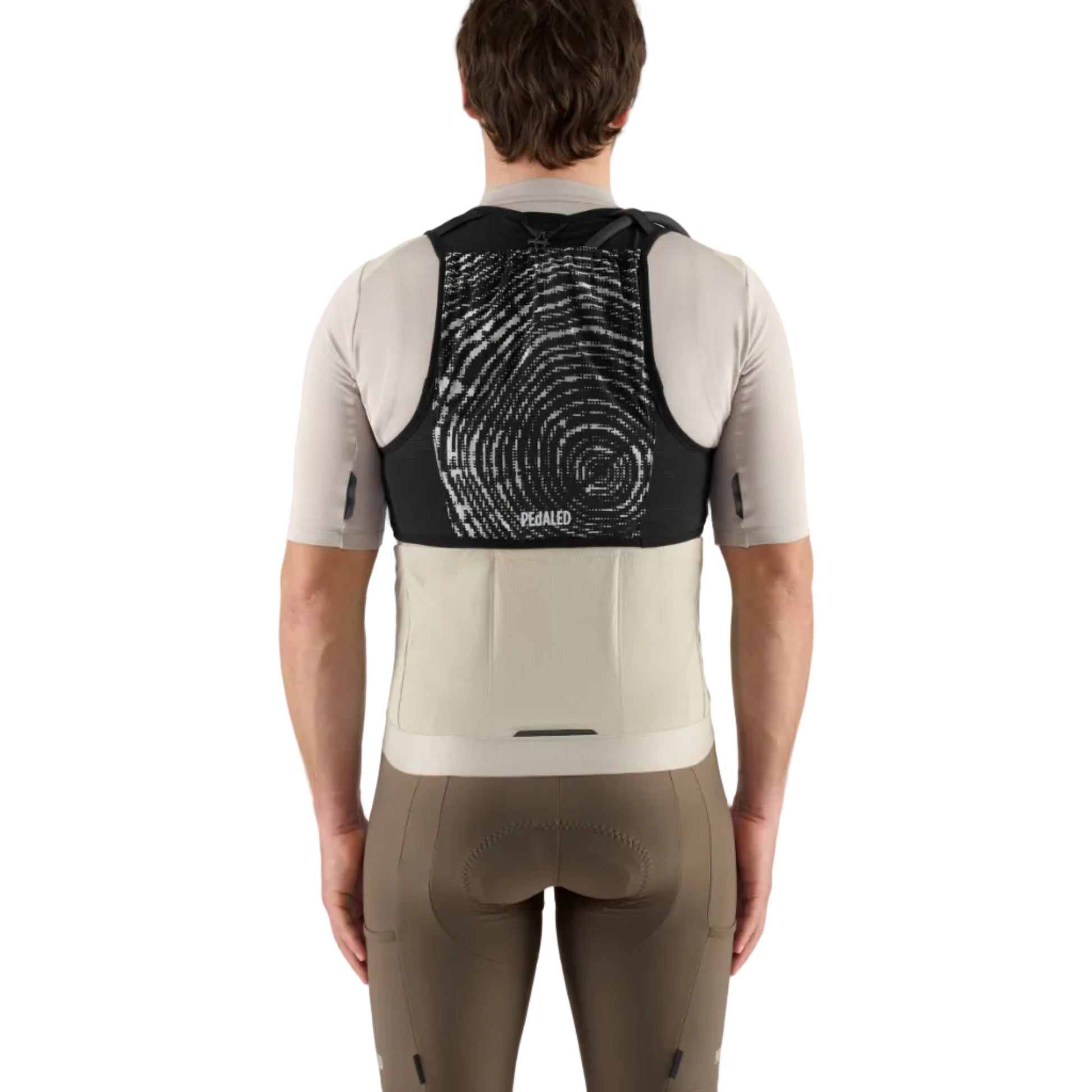 Person wearing a cycling outfit with a black and white back design on a gray background