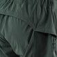 Close up detail of dark green PeDaLED Yuma Trail Pants for trail riding, bikepacking and adventure cycling