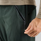 Dark green PeDaLED Yuma Trail Pants for trail riding, bikepacking and adventure cycling
