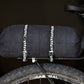 Mica Cycles Mini Cam Strap with ARNO plated steel cam buckle, custom polypropylene webbing and double-ring rack retention loops.
