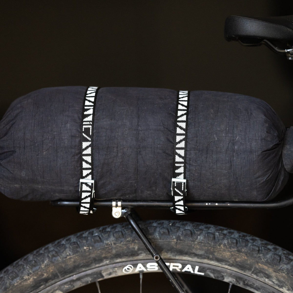 Mica Cycles Mini Cam Strap with ARNO plated steel cam buckle, custom polypropylene webbing and double-ring rack retention loops.