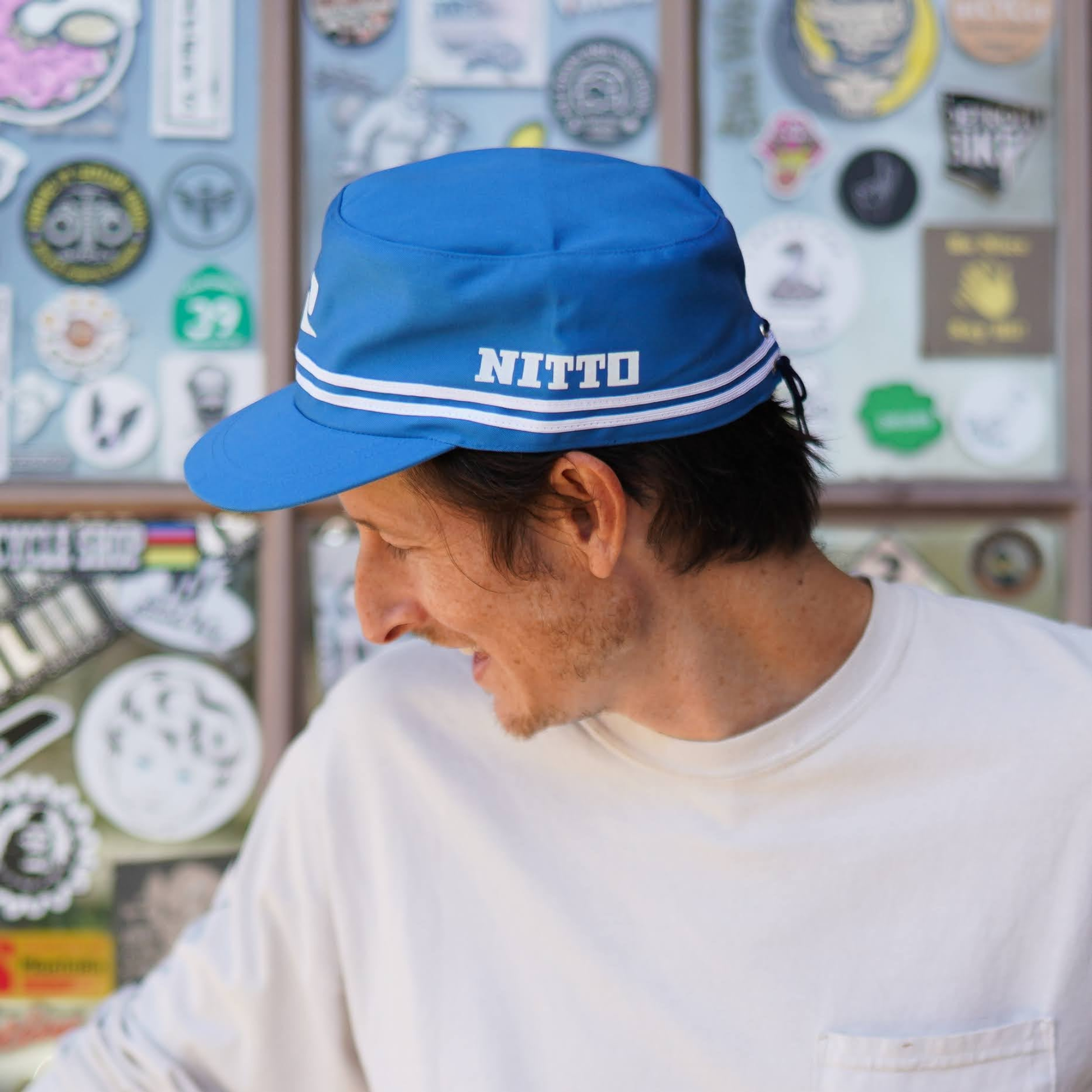 A man wearing the Nitto Factory Work Cap by SimWorks.