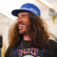 A smiling man wearing the Nitto Factory Work Cap by SimWorks.