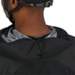 Patagonia Dirt Roamer Storm Bike Jacket in Black worn by model, hood detail for rolling up