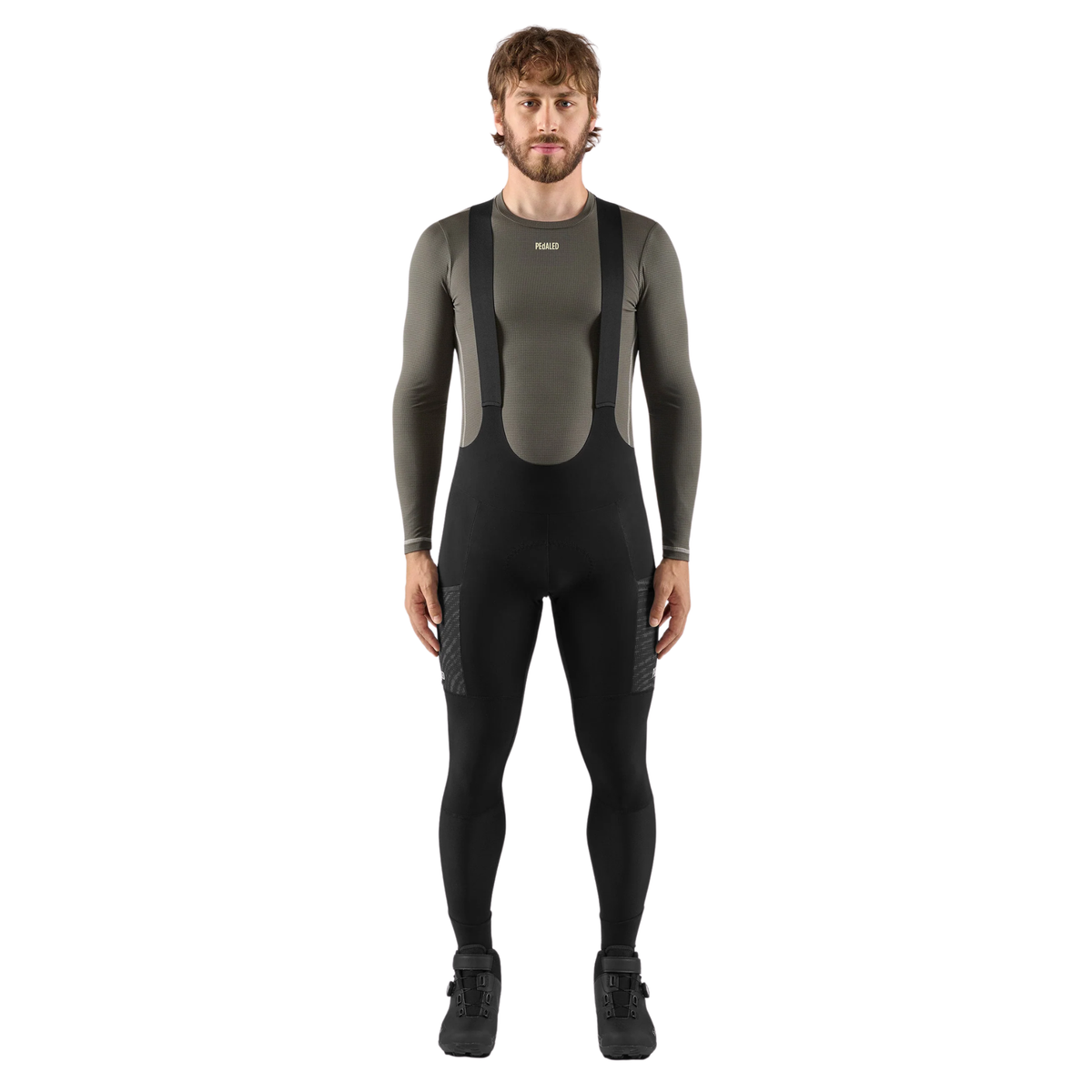 PEdALED Odyssey men's winter cycling bib tights featuring insulating fleece, weather-resistant thigh panels, three cargo pockets and reflective leg details.