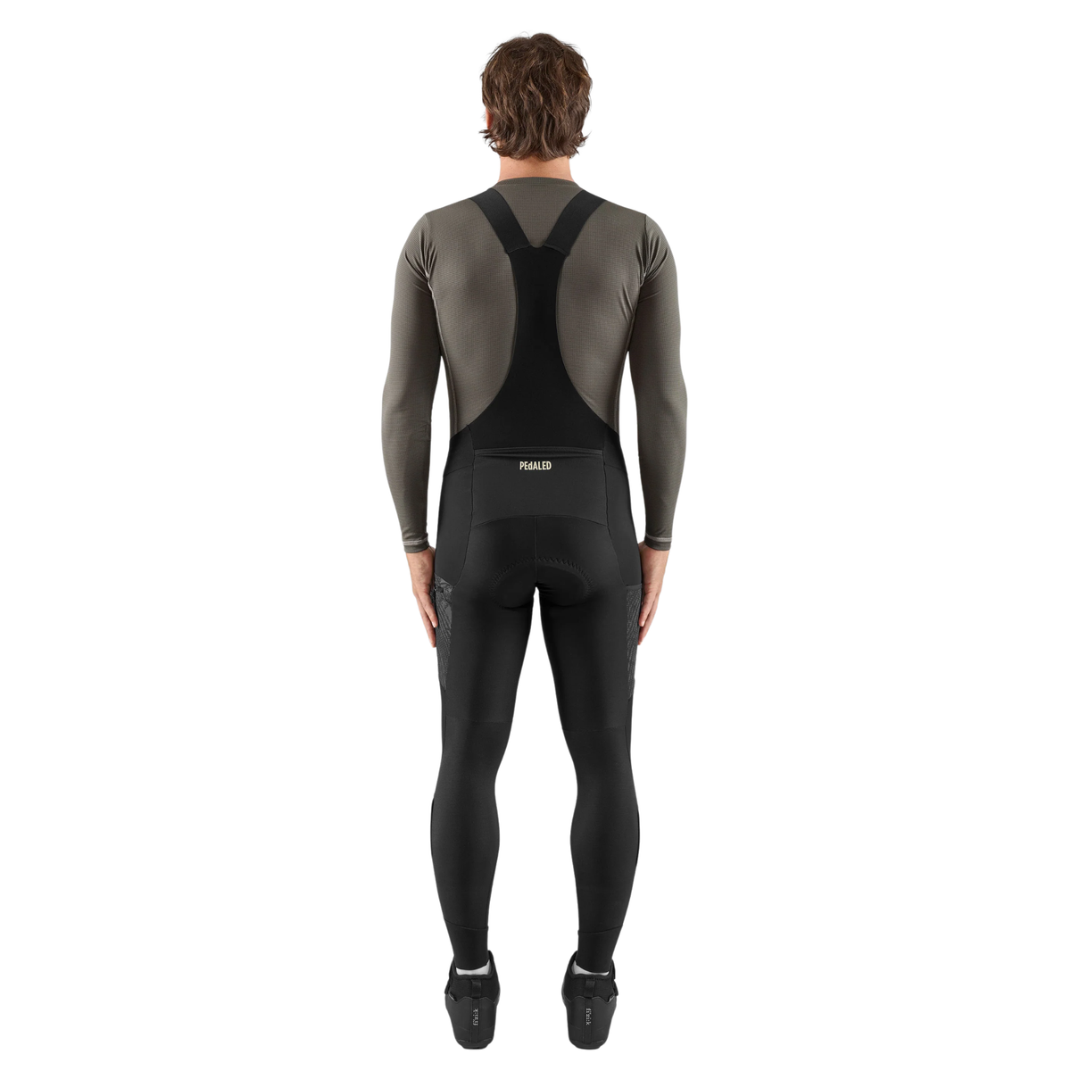 PEdALED Odyssey men's winter cycling bib tights featuring insulating fleece, weather-resistant thigh panels, three cargo pockets and reflective leg details.