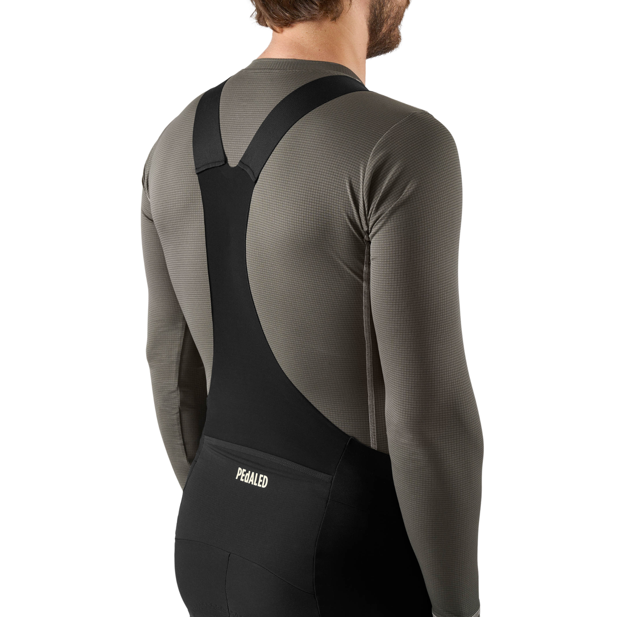 PEdALED Odyssey men's winter cycling bib tights featuring insulating fleece, weather-resistant thigh panels, three cargo pockets and reflective leg details.