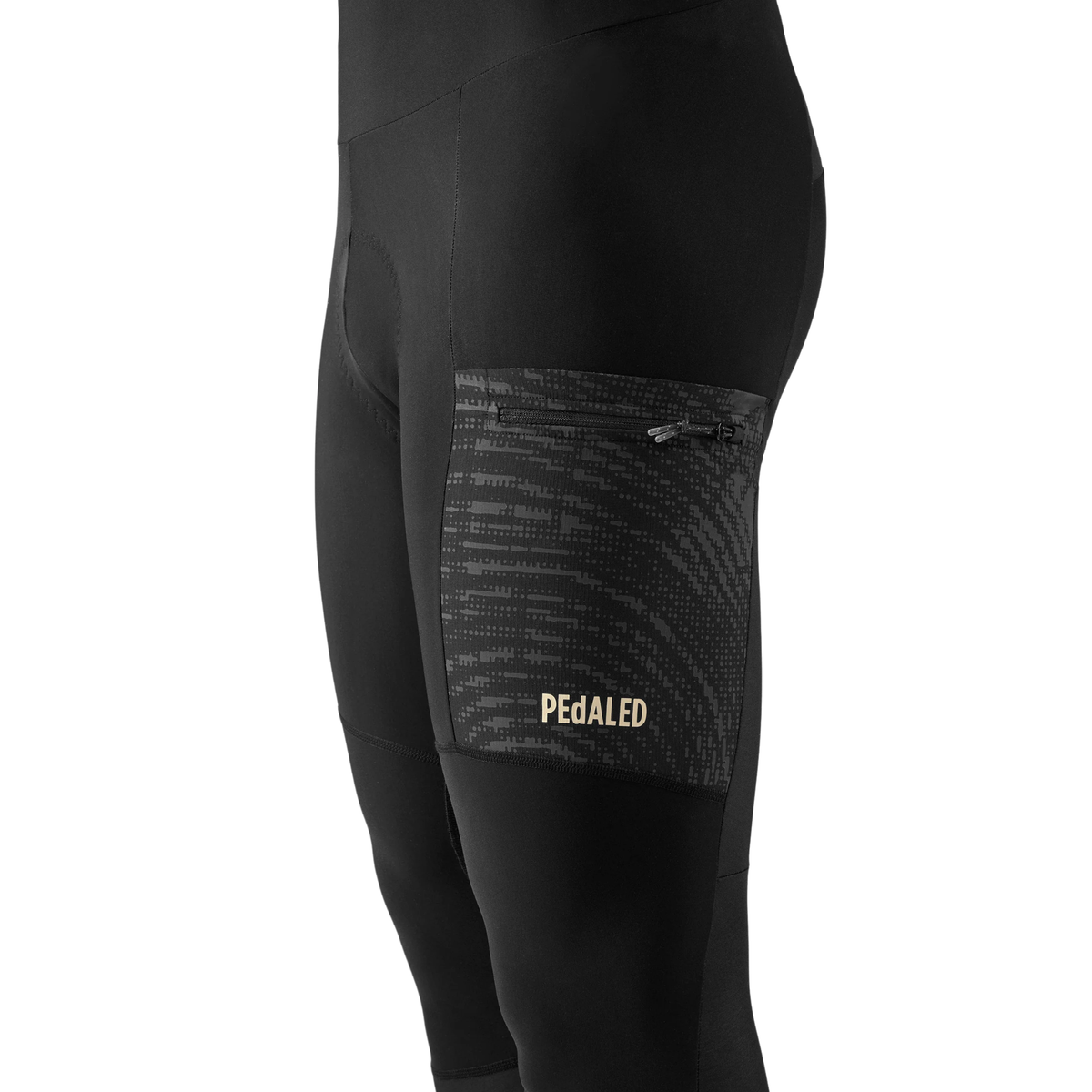 PEdALED Odyssey men's winter cycling bib tights featuring insulating fleece, weather-resistant thigh panels, three cargo pockets and reflective leg details.