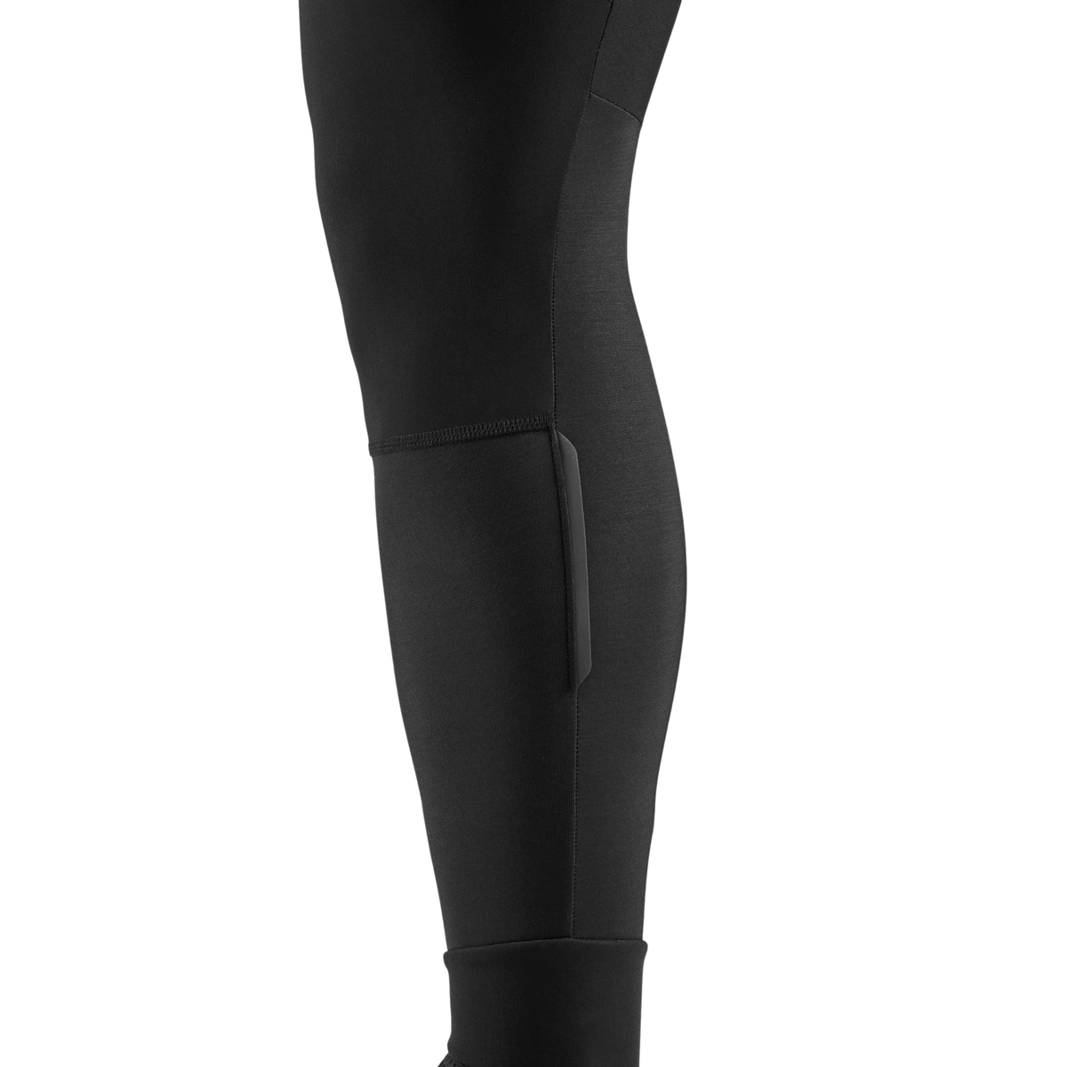 PEdALED Odyssey men's winter cycling bib tights featuring insulating fleece, weather-resistant thigh panels, three cargo pockets and reflective leg details.