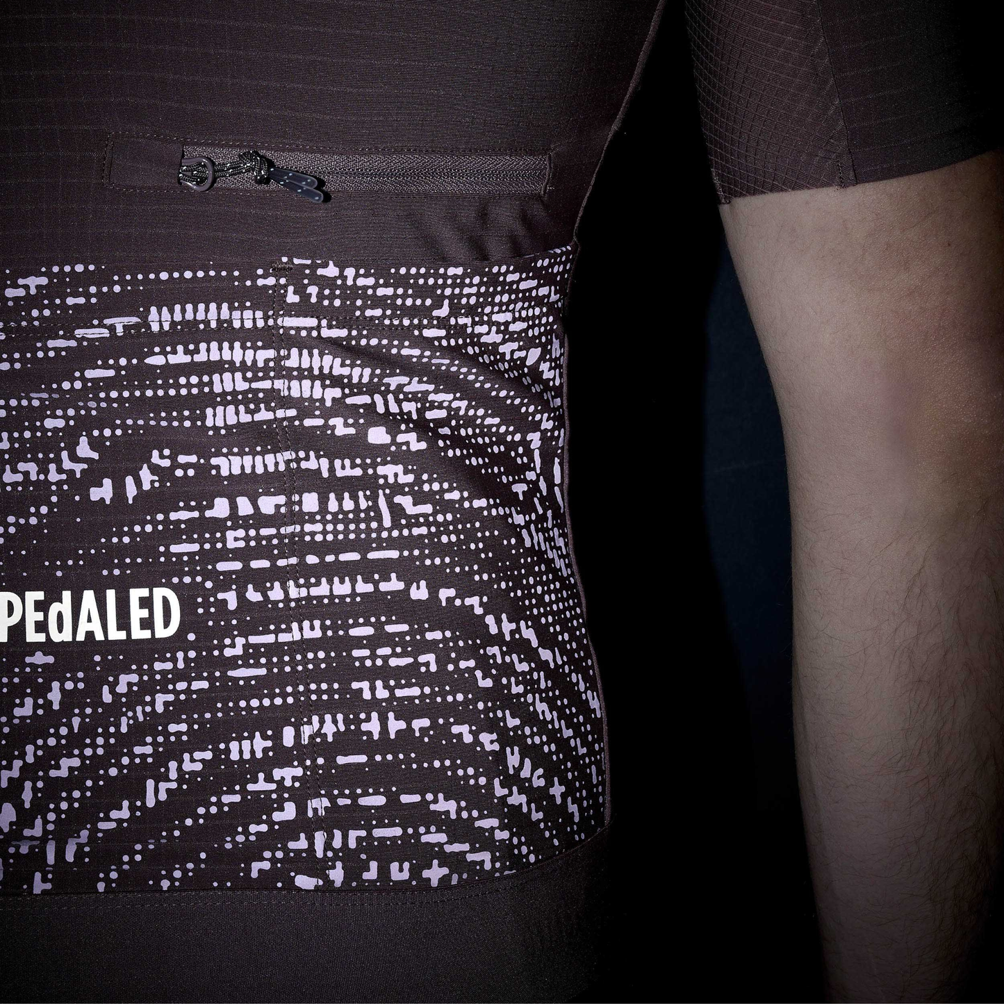 PEdALED Odyssey Jersey in Dark Purple back reflective details