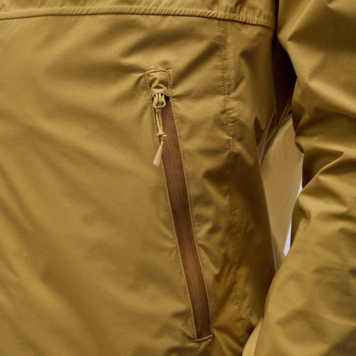 PEdALED Odyssey men's and women's waterproof cycling shell jacket featuring 2.5-layer laminated fabric, sealed seams, helmet-compatible hood and relaxed fit.
