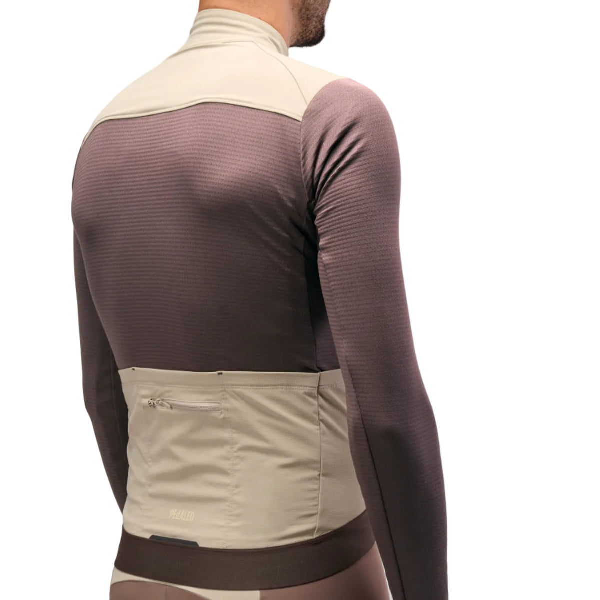 PEdALED Odyssey Windblock Merino long-sleeve men's cycling jersey with wind-blocking chest panels, seven storage pockets and reflective rear details.