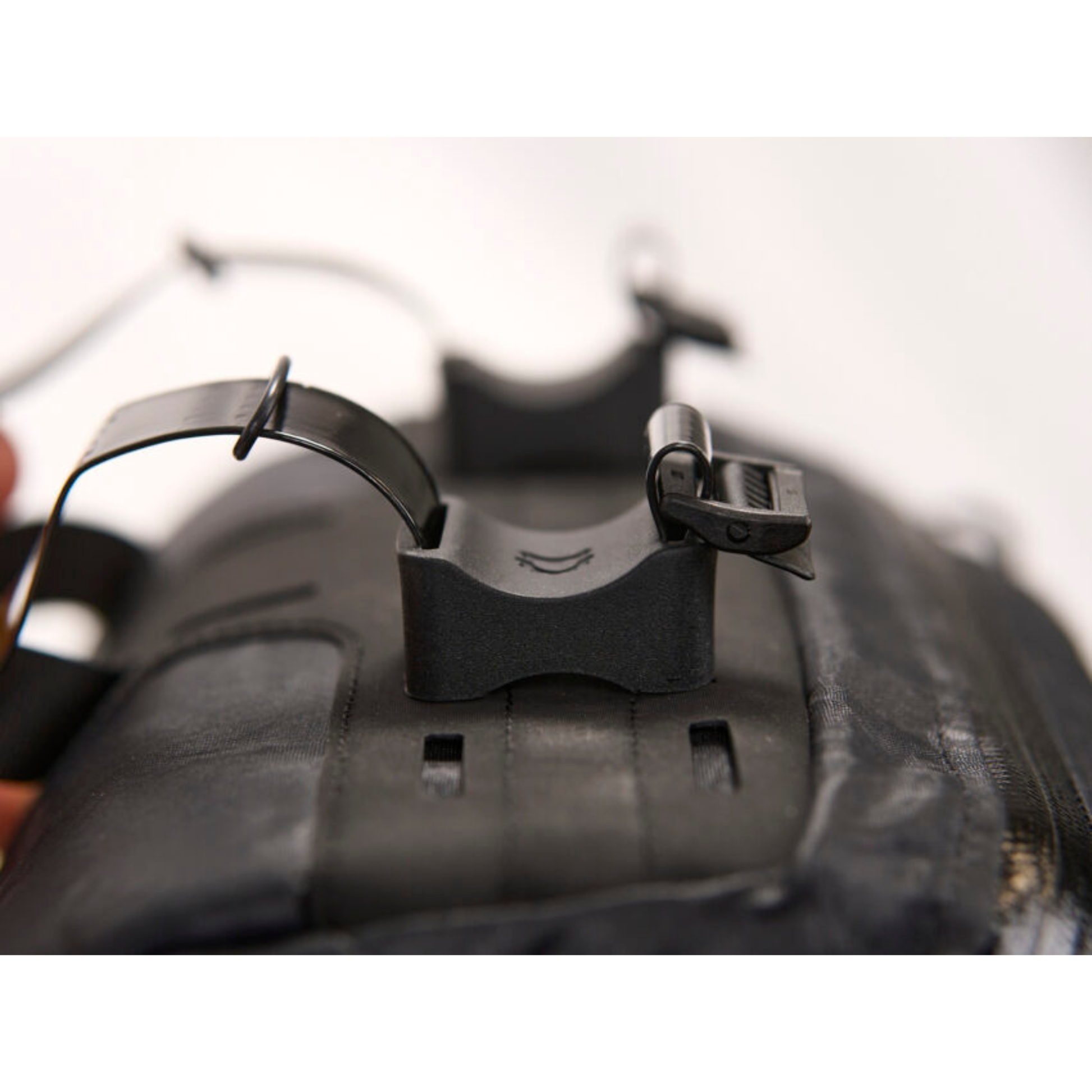 Revelate Designs Campamocha handlebar bag mounting rubbers close up view