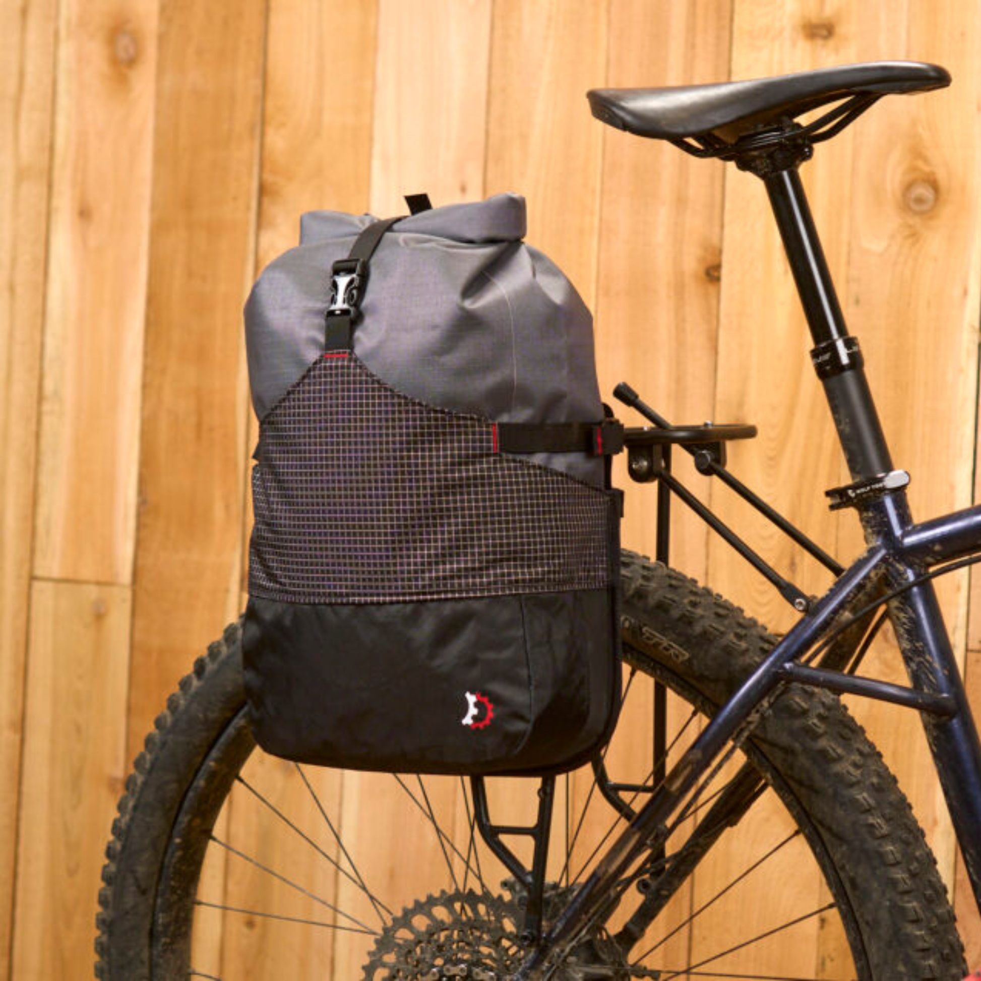 Revelate Designs Portage Panniers installed on a bike rear rack, front right view