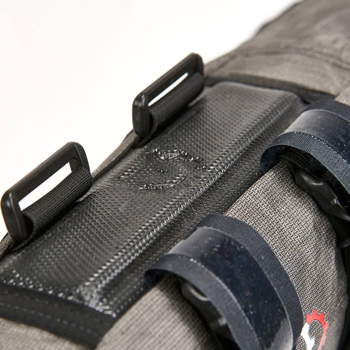 Revelate Designs Ultra Joey downtube bag, a lightweight Challenge Ultra 200 X bikepacking bag with roll-down closure and stable off-road mounting.