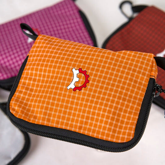 Revelate Designs Skedaddle Bag compact organizer pouch for bike trip essentials, made from woven Dyneema or recycled Challenge UltraGrid.