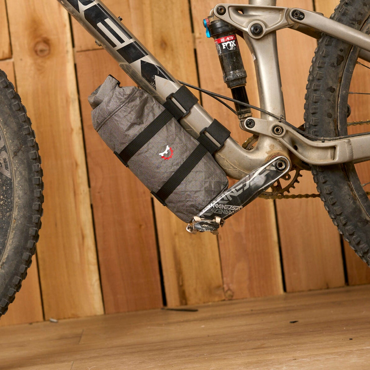 Revelate Designs Ultra Joey downtube bag, a lightweight Challenge Ultra 200 X bikepacking bag with roll-down closure and stable off-road mounting.
