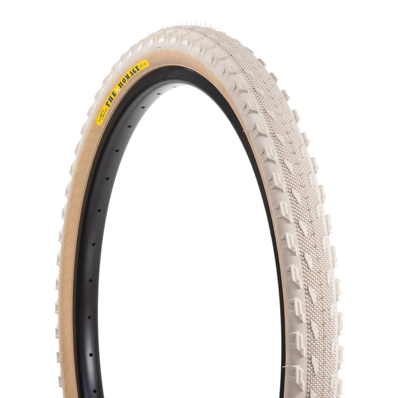 SimWorks Homage LTD Sand Beige 26 x 1.95" tire, developed with Panaracer with a semi-slick tread, gravel-gripping side knobs and flexible casing.