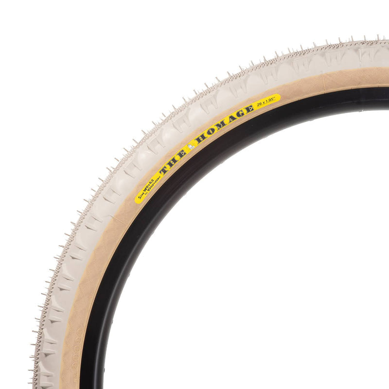 SimWorks Homage LTD Sand Beige 26 x 1.95" tire, developed with Panaracer with a semi-slick tread, gravel-gripping side knobs and flexible casing.