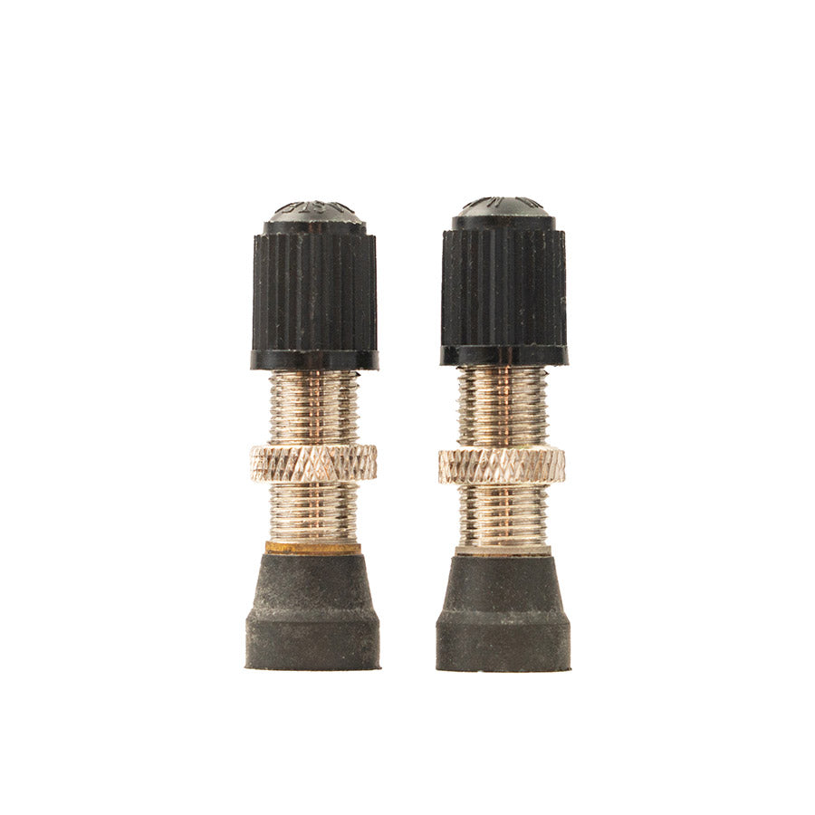Stan’s tubeless Schrader valve brass standing next to each other