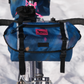 Swift Industries Luminary Catalyst Pack closed, mounted on a bicycle handlebar front view