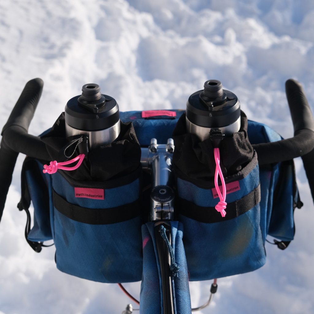 Swift Industries Luminary double Gibby Stem Bag mounted on a bike and carrying one bottle each