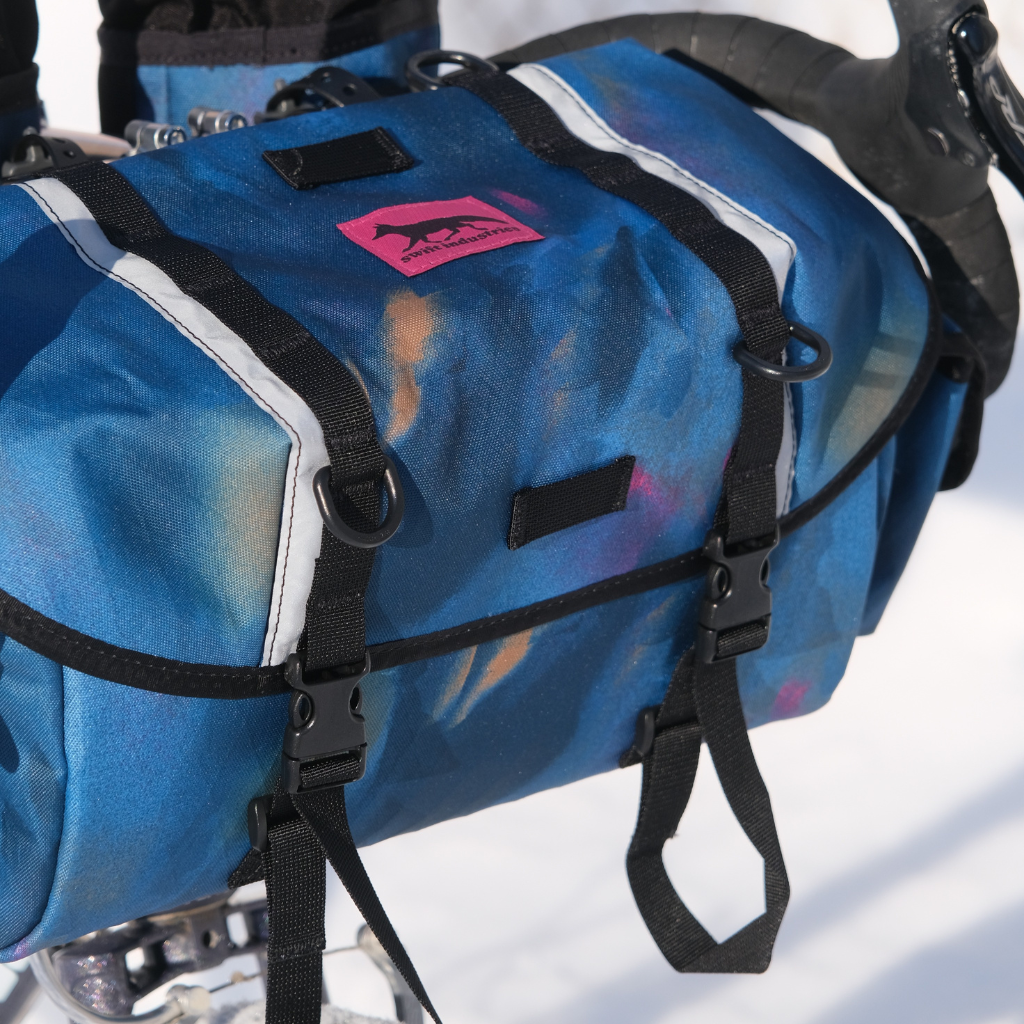 Swift Industries Luminary Zeitgeist Pack handlebar pack mounted on a bike, close up view